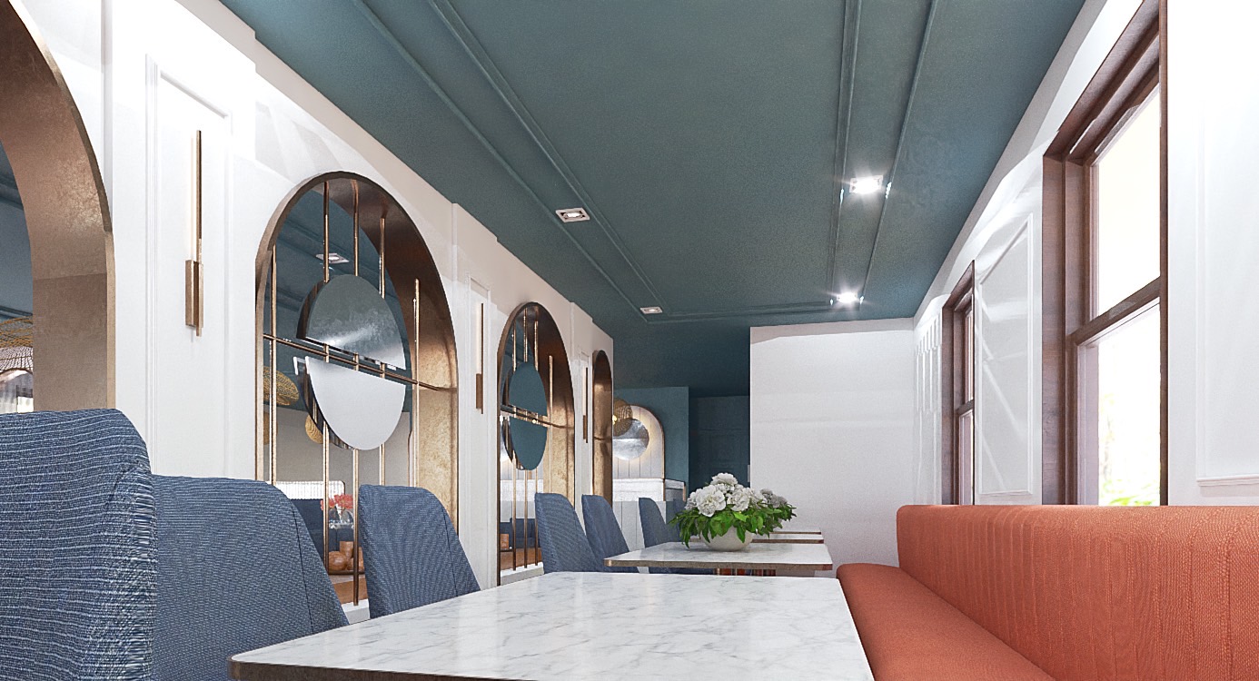 Elegant interior of Prettiplatters restaurant featuring arched mirrors, slate blue ceiling, brass fixtures, and comfortable dining spaces